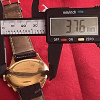 Montre Baume & Mercier chronographe en or 18K