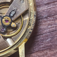 Montre oméga Genève or 18k