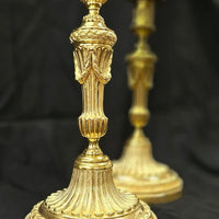 Paire de flambeaux en bronze Louis XVI doré