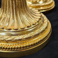 Paire de flambeaux en bronze Louis XVI doré