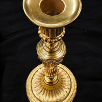 Paire de flambeaux en bronze Louis XVI doré