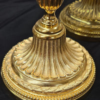 Paire de flambeaux en bronze Louis XVI doré