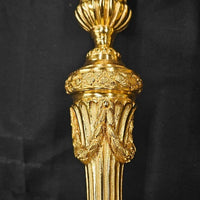 Paire de flambeaux en bronze Louis XVI doré